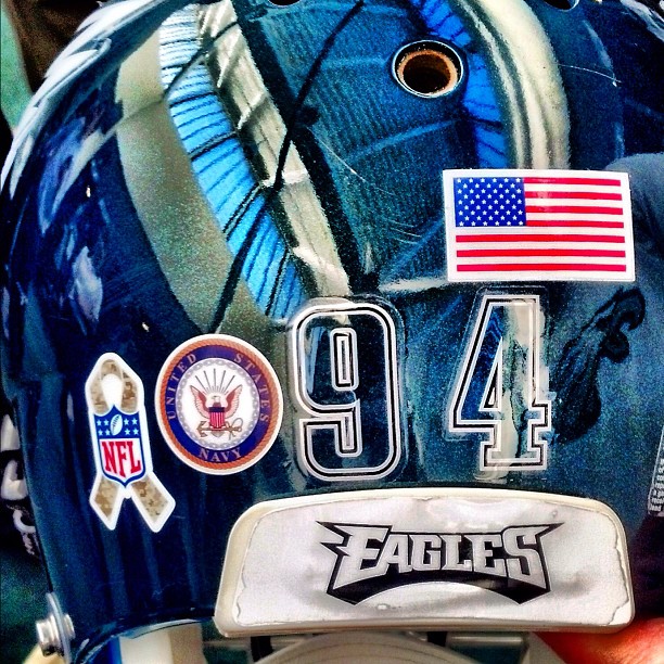 helmets feat. a sticker that represents a branch of military.