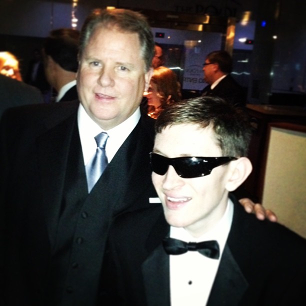 A pair of Kellys: Head Coach Chip Kelly with renowned National Anthem singer Timmy Kelly.